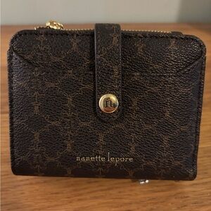 Nanette Lepore bifold wallet in a black and brown logo print faux leather